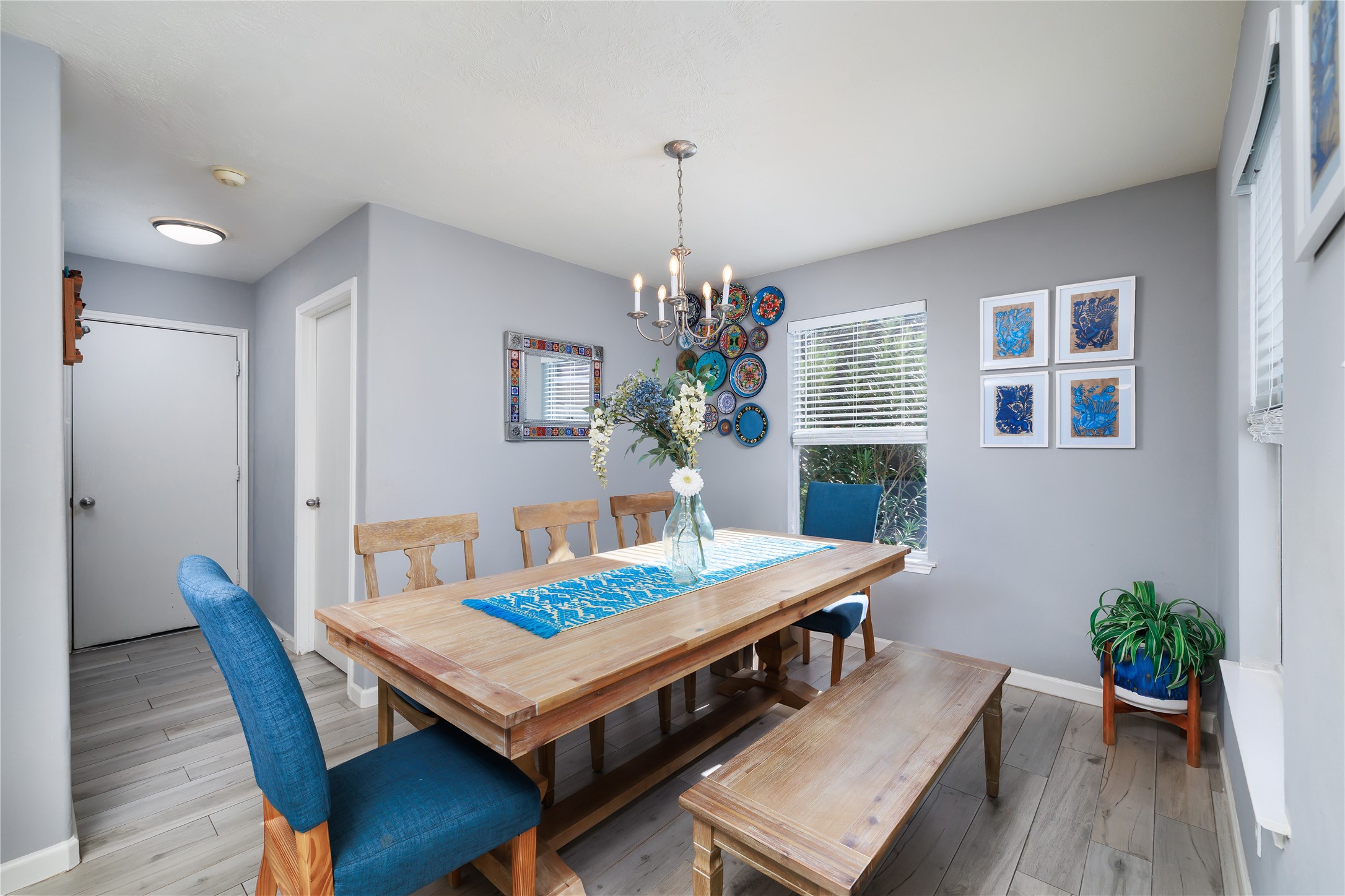 143 South Vesper Bend Circle Spring, TX 77382 - Photo 12 of 31 a dining room with furniture potted plants and wooden floor