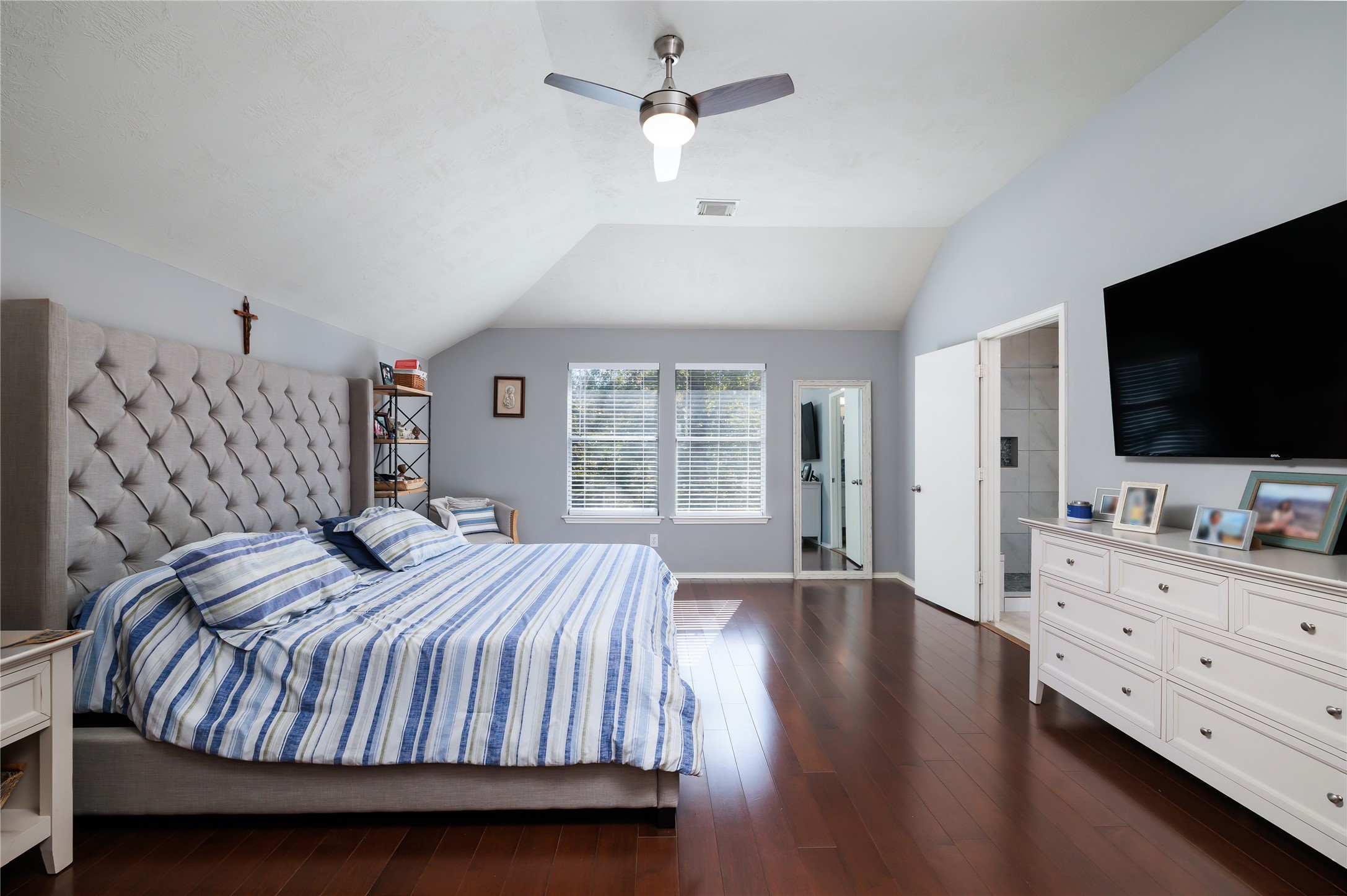 143 South Vesper Bend Circle Spring, TX 77382 - Photo 16 of 31 a bedroom with a bed and a flat screen tv