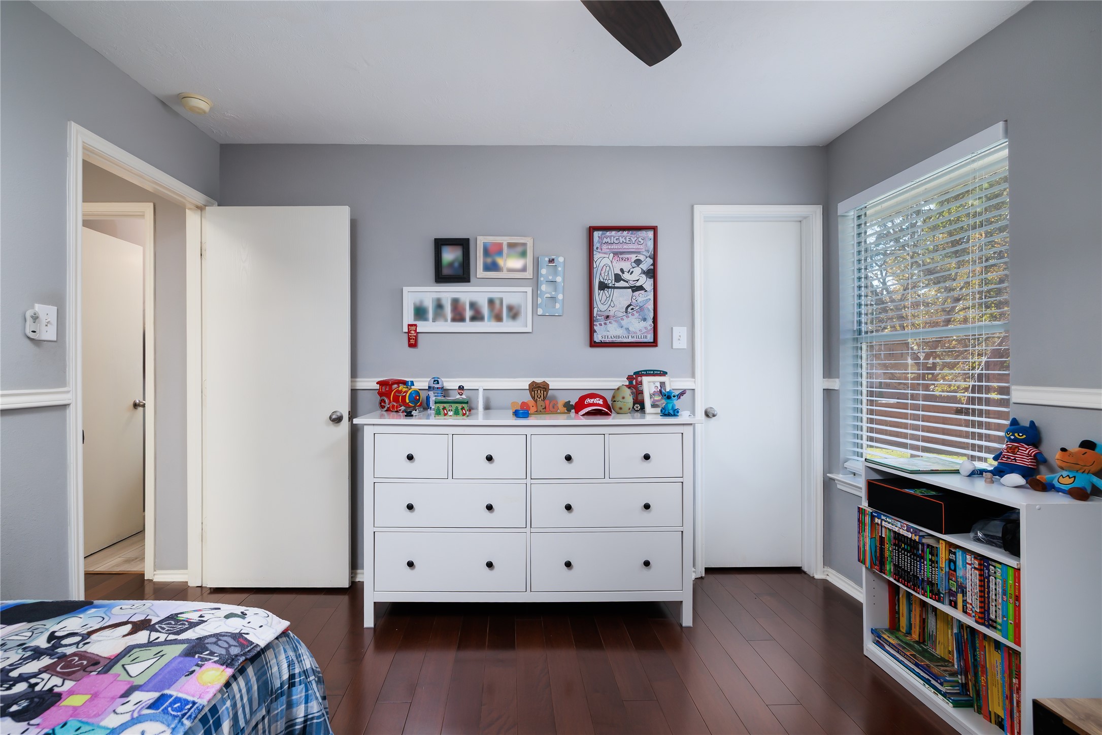 143 South Vesper Bend Circle Spring, TX 77382 - Photo 27 of 31 a bedroom with a bed and wooden floor