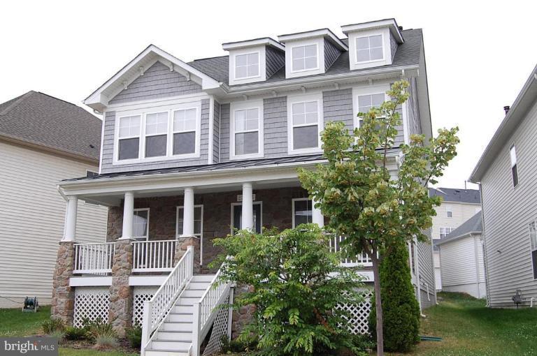 23841 Burdette Forest Road Clarksburg, MD 20871 - Photo 1 of 1 a front view of a house with plants and garden