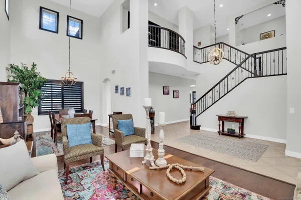 a dining room with furniture window and entryway