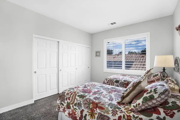 a bathroom with a double vanity sink mirror and toilet