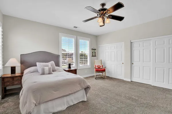 a bed room with bed and a window