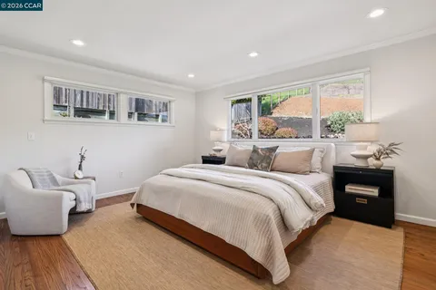 a bathroom with a sink vanity granite and a mirror