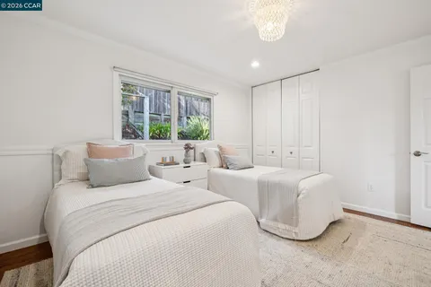 a view of a house with backyard sitting area and garden