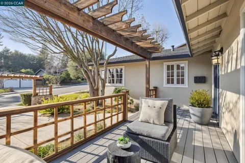 a view of a chairs and table in the patio