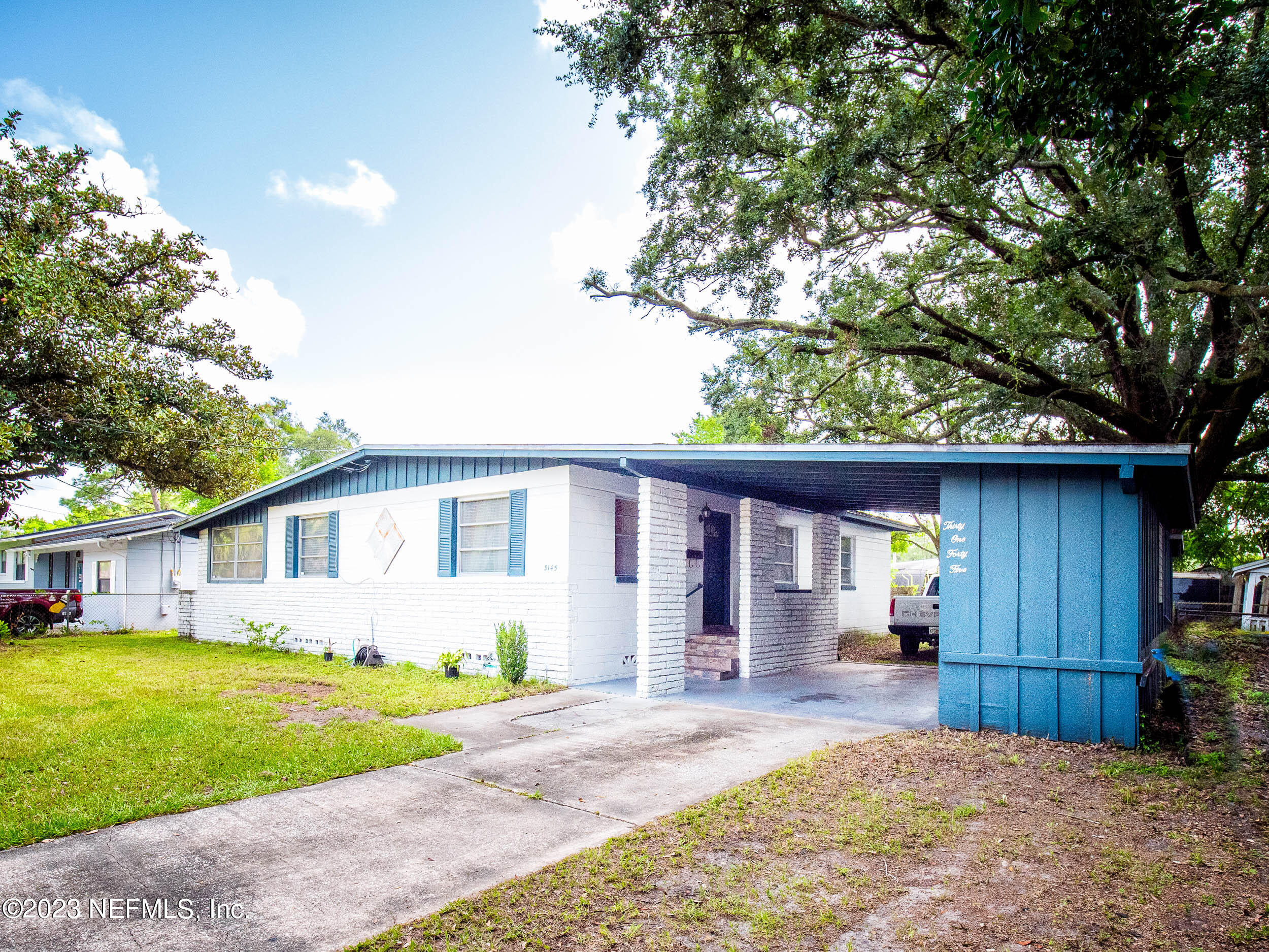 3145 Rogero Road Jacksonville, FL 32277 - Photo 3 of 21 a view of a house with a yard