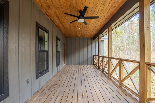 a view of staircase with a large window with wooden floor