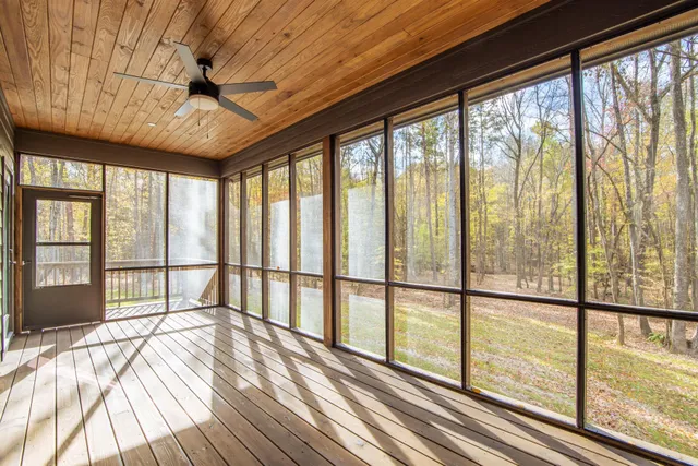 a view of a room with wooden floor and balcony