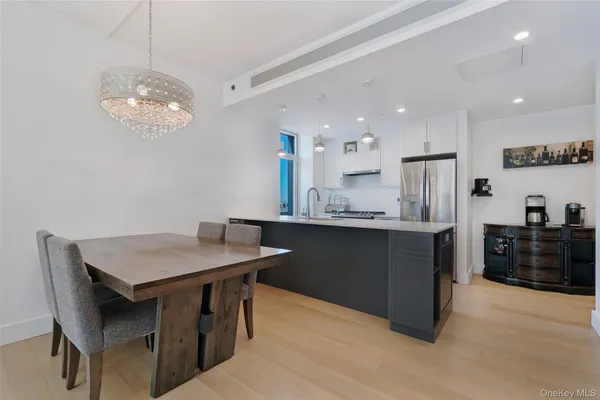 a kitchen with a table and chairs in it