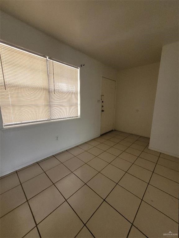 1612 Orange Avenue, Unit 13 Weslaco, TX 78596 - Photo 9 of 12 Unfurnished room featuring light tile patterned floors