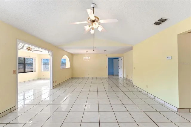 a kitchen that has a sink and a stove in it