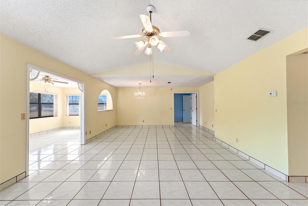 4141 Southwest Sailfish Road Dunnellon, FL 34431 - Photo 13 of 63 a view of an room with a chandelier fan and windows