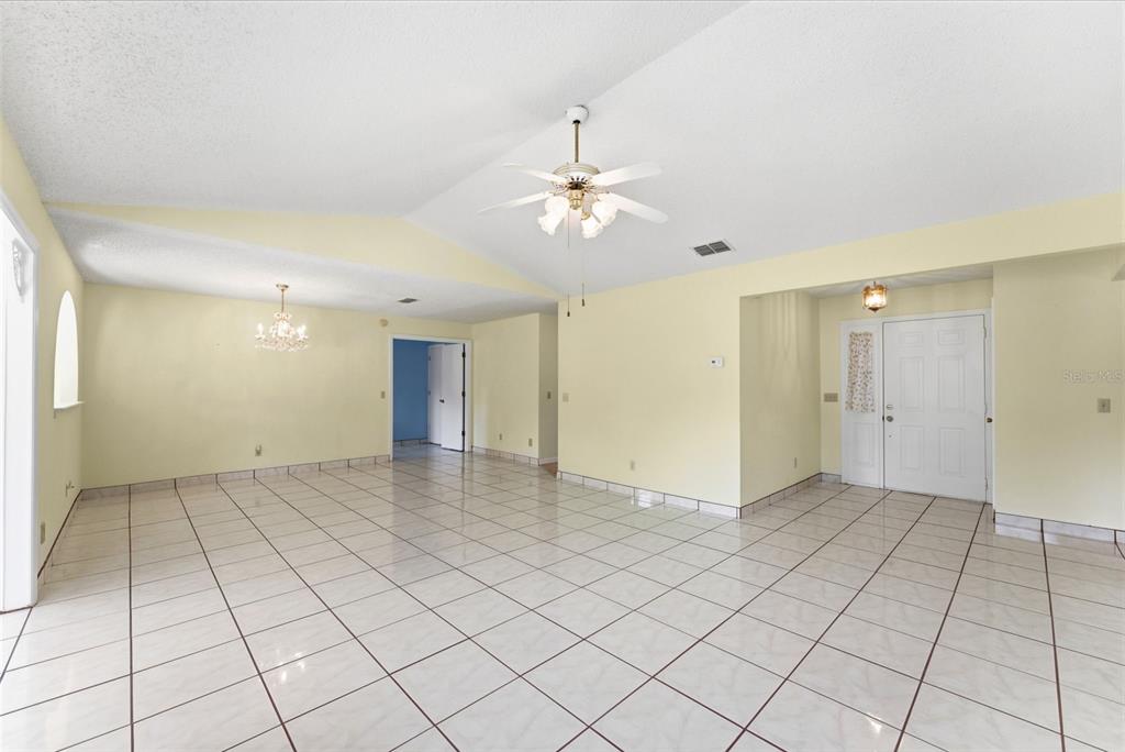 4141 Southwest Sailfish Road Dunnellon, FL 34431 - Photo 14 of 63 a view of an empty room and chandelier fan