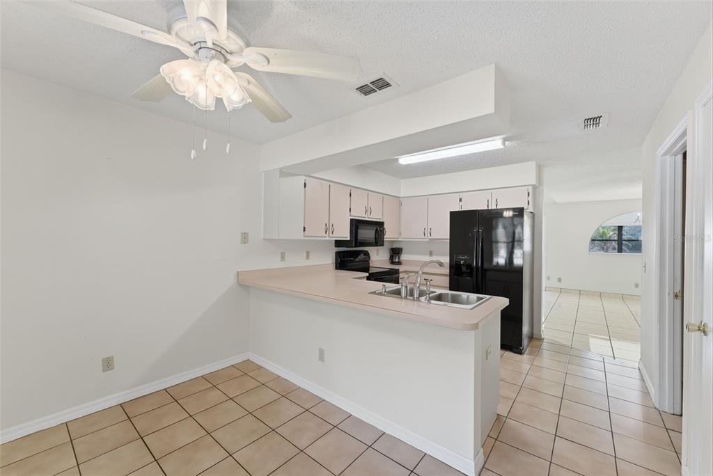 4141 Southwest Sailfish Road Dunnellon, FL 34431 - Photo 20 of 63 a kitchen with a sink appliances and cabinets