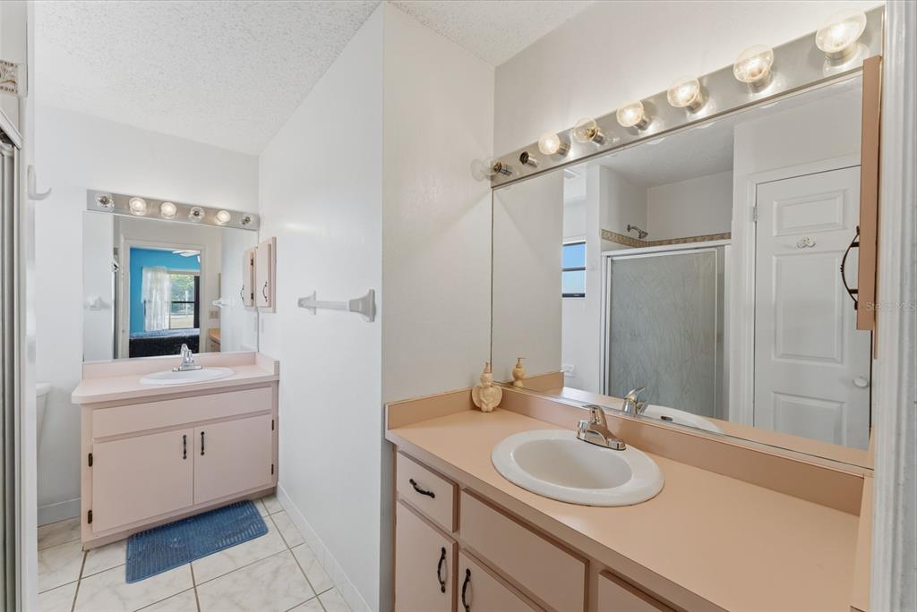 4141 Southwest Sailfish Road Dunnellon, FL 34431 - Photo 28 of 63 a bathroom with a sink a toilet a mirror and shower