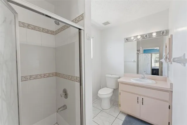 a bathroom with a sink vanity and a mirror