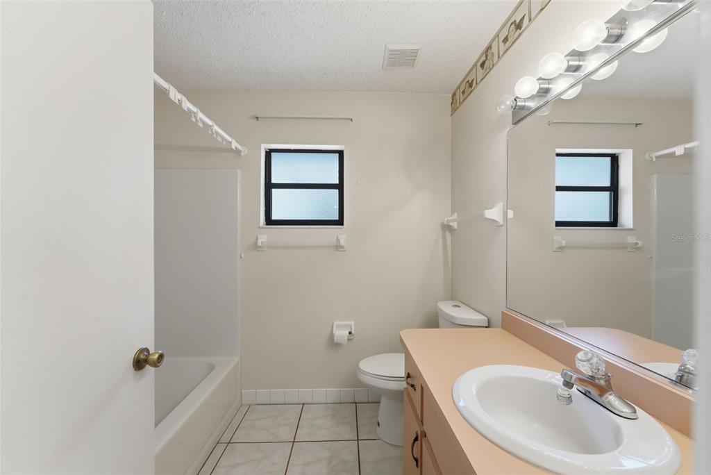 4141 Southwest Sailfish Road Dunnellon, FL 34431 - Photo 33 of 63 a bathroom with a sink a toilet and shower