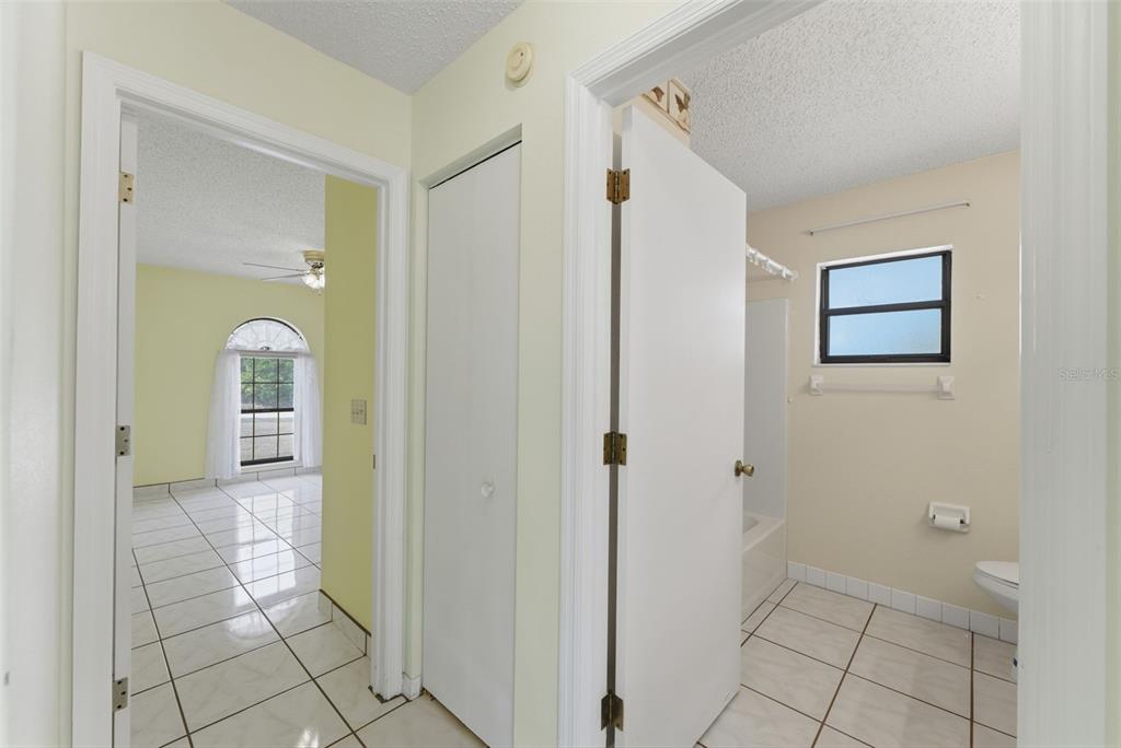 4141 Southwest Sailfish Road Dunnellon, FL 34431 - Photo 36 of 63 a view of a hallway with wooden floor and a bathroom