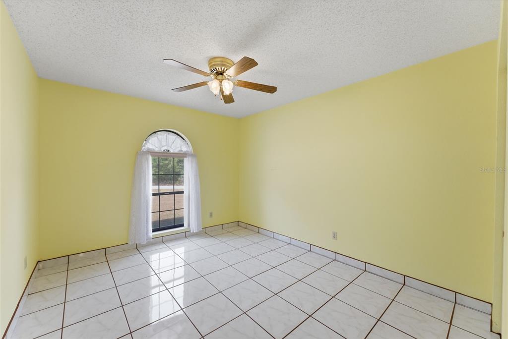 4141 Southwest Sailfish Road Dunnellon, FL 34431 - Photo 37 of 63 an empty room with windows