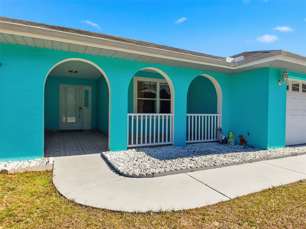 4141 Southwest Sailfish Road Dunnellon, FL 34431 - Photo 4 of 63 a view of a house with a small yard