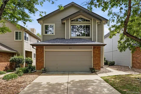 a view of a house with a bench