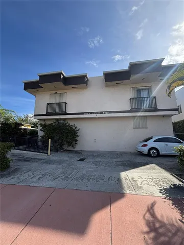 a kitchen with kitchen island stainless steel appliances a sink and a stove