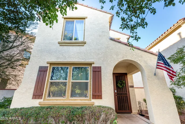 a front view of a house with large windows