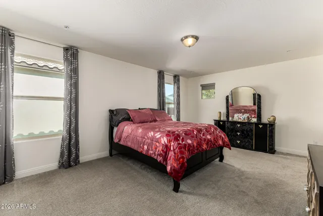 a view of a chairs and table in backyard