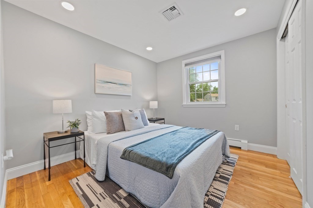 56 Cedarcrest Road Hanover, MA 02339 - Photo 12 of 26 a bedroom with a bed and a table