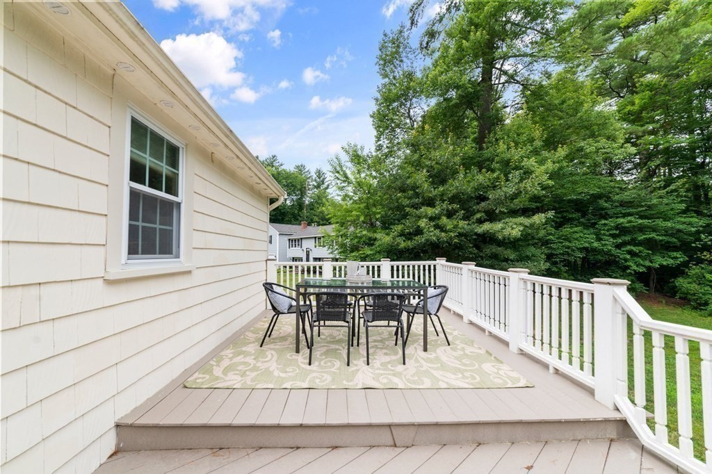 56 Cedarcrest Road Hanover, MA 02339 - Photo 21 of 26 a view of a patio with table and chairs and wooden floor