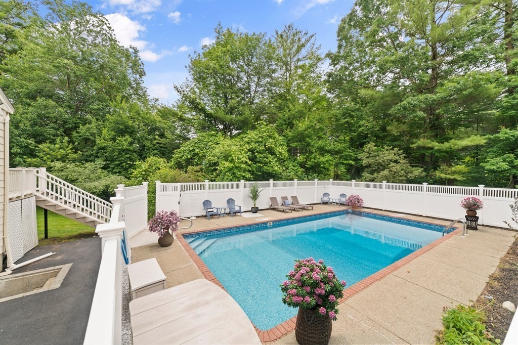 56 Cedarcrest Road Hanover, MA 02339 - Photo 22 of 26 a view of a swimming pool with a lounge chairs