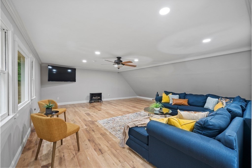 56 Cedarcrest Road Hanover, MA 02339 - Photo 24 of 26 a living room with furniture and a flat screen tv