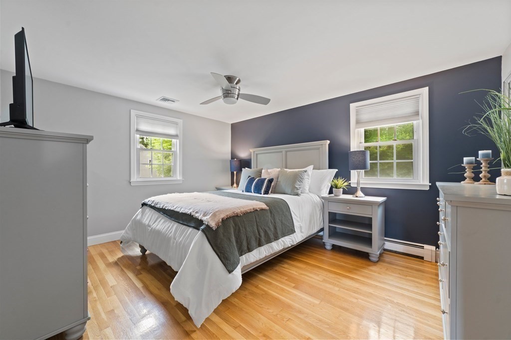 56 Cedarcrest Road Hanover, MA 02339 - Photo 10 of 26 a bedroom with a bed and a chandelier