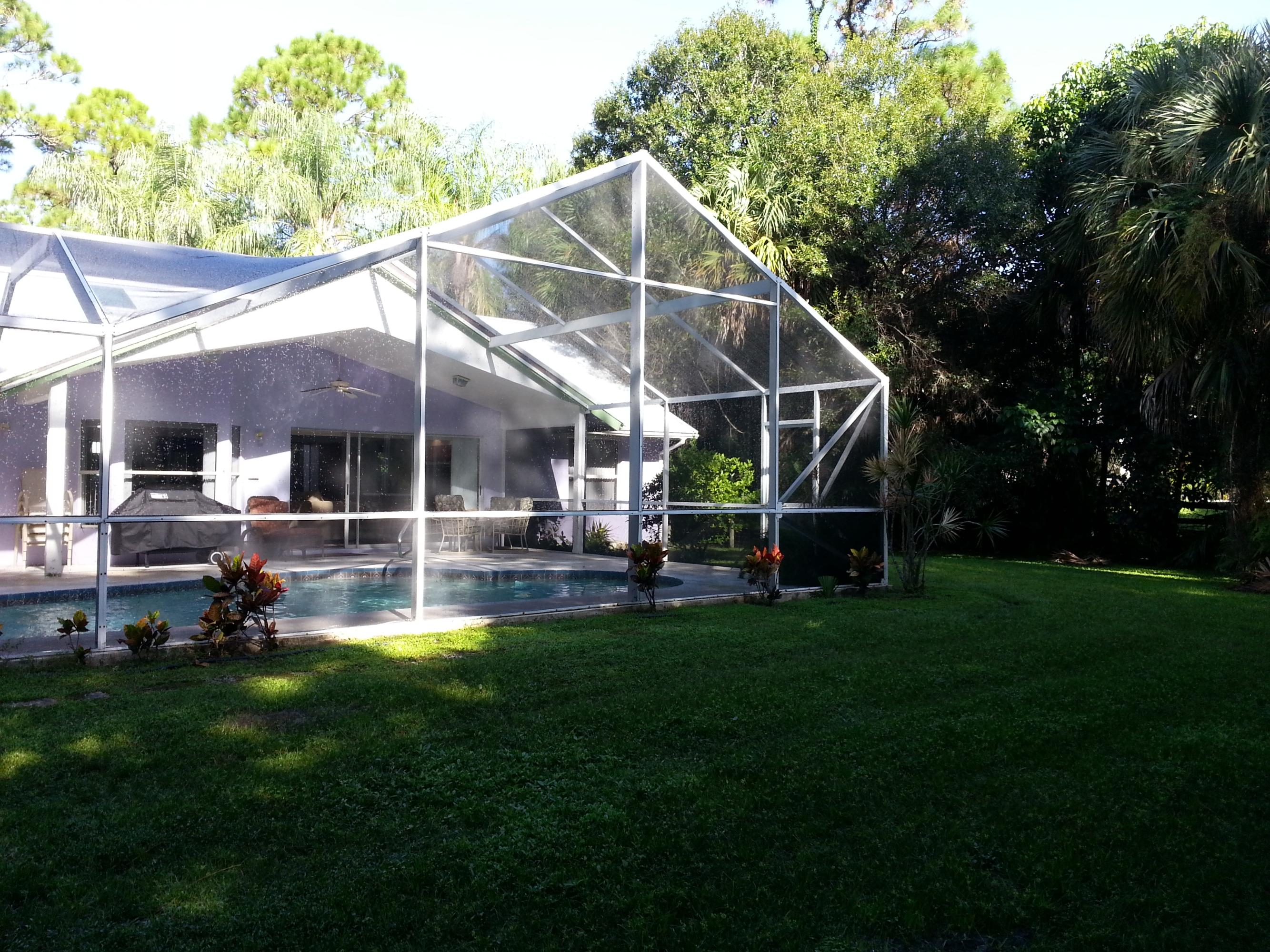 16210 Jupiter Farms Road Jupiter, FL 33478 - Photo 25 of 27 Yard and Pool Enclosure