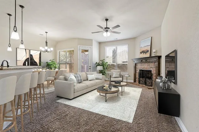 a living room with furniture fireplace and a chandelier