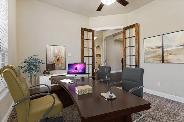 a bedroom with bed and a chandelier