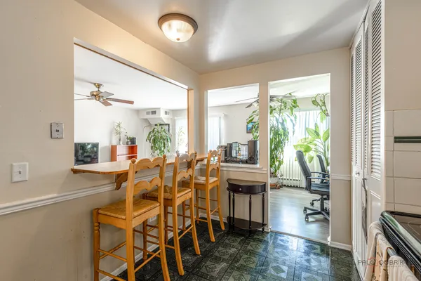 a view of a dining room with furniture window and outside view