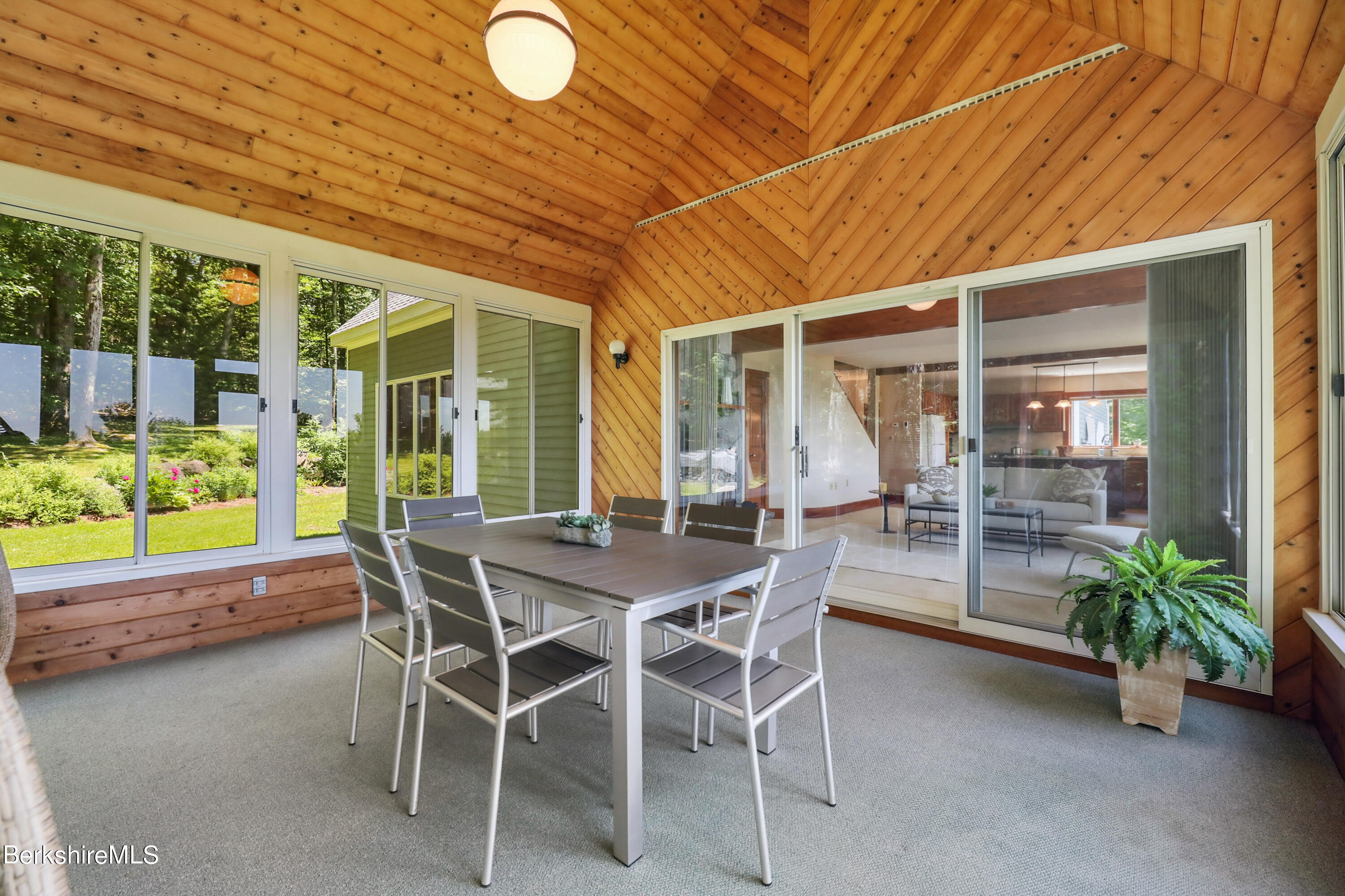 86 George Carter Road Becket, MA 01223 - Photo 15 of 35 a view of a patio with table and chairs and potted plants