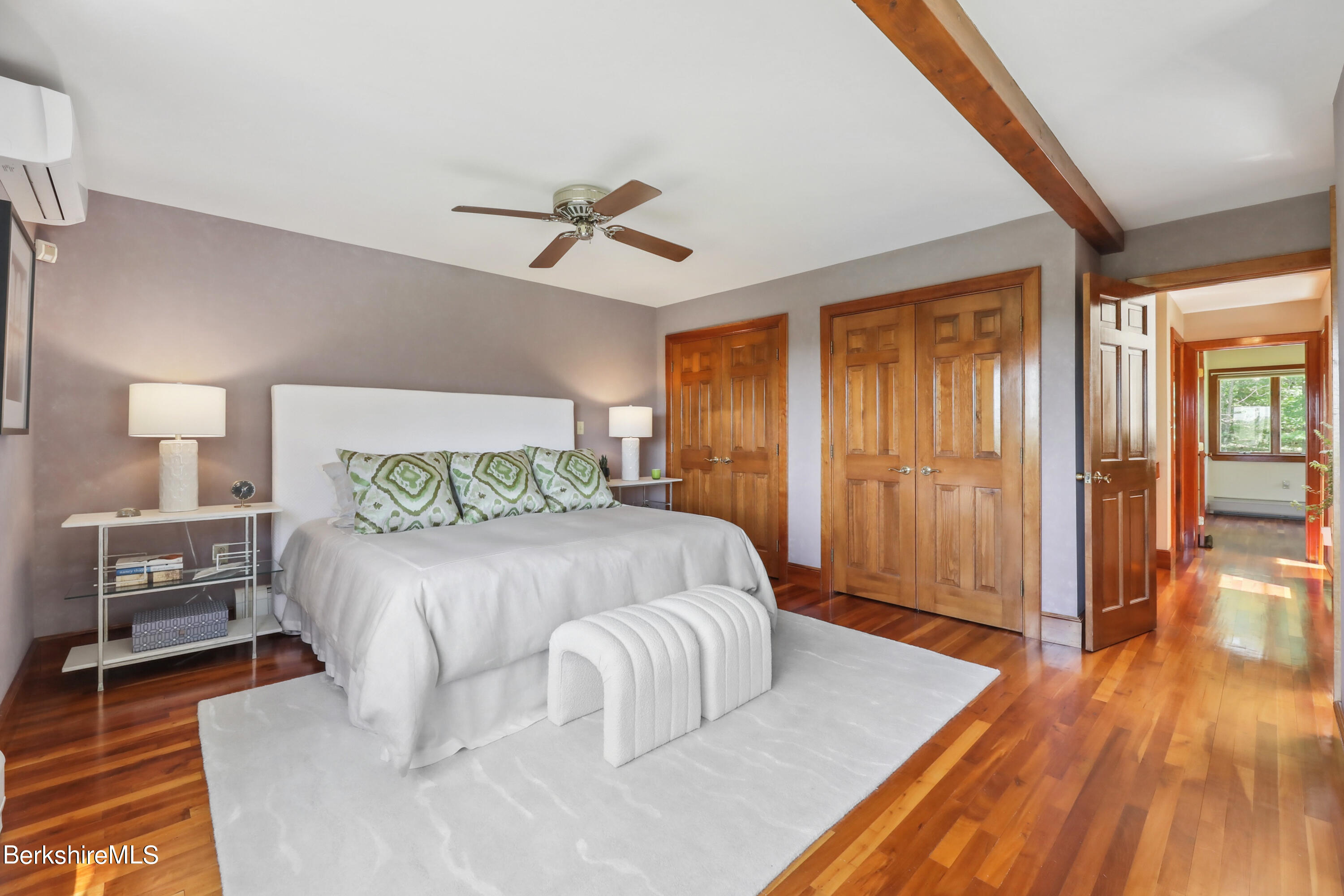 86 George Carter Road Becket, MA 01223 - Photo 17 of 35 a bedroom with a bed and wooden floor