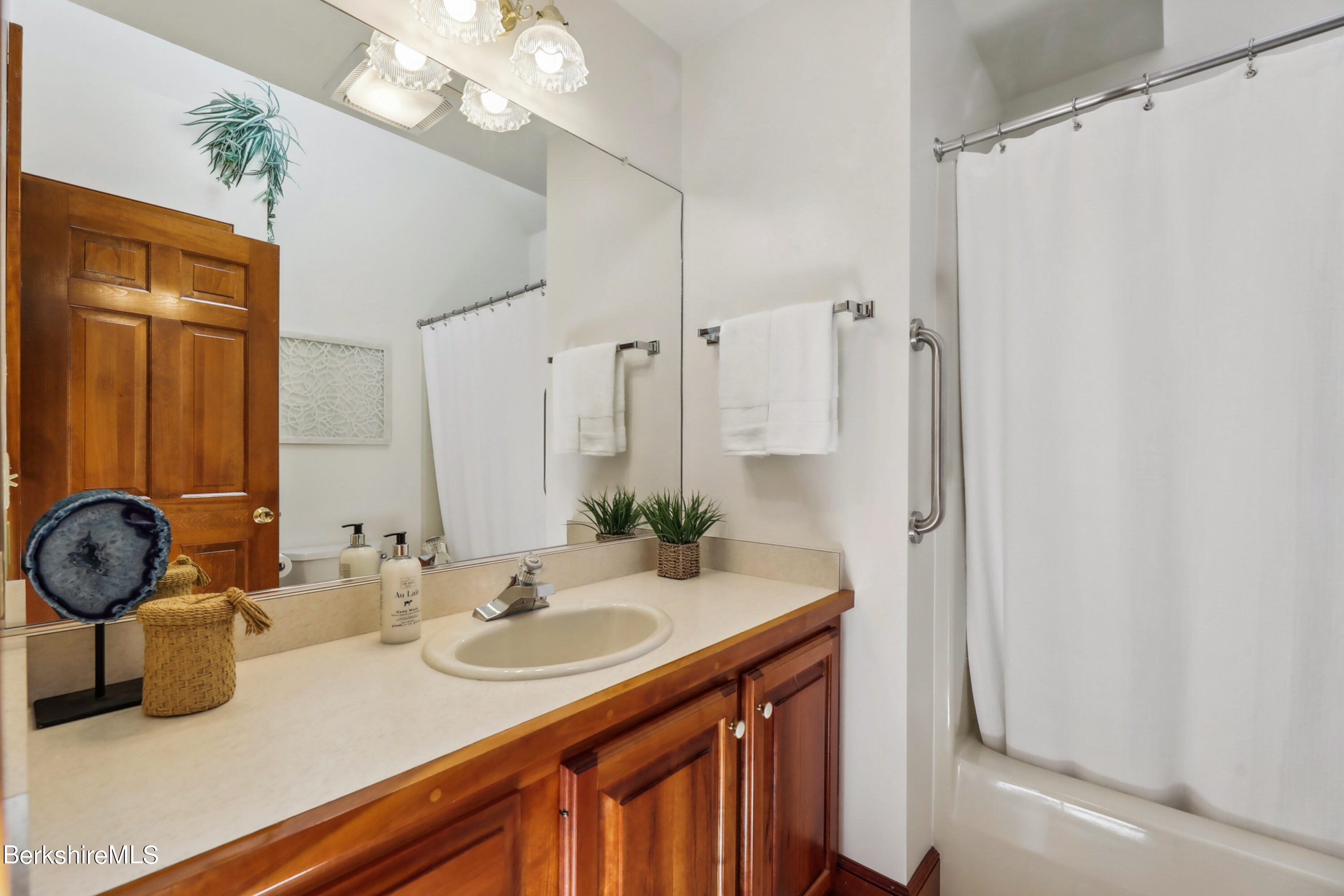 86 George Carter Road Becket, MA 01223 - Photo 23 of 35 a bathroom with a sink double vanity and a mirror