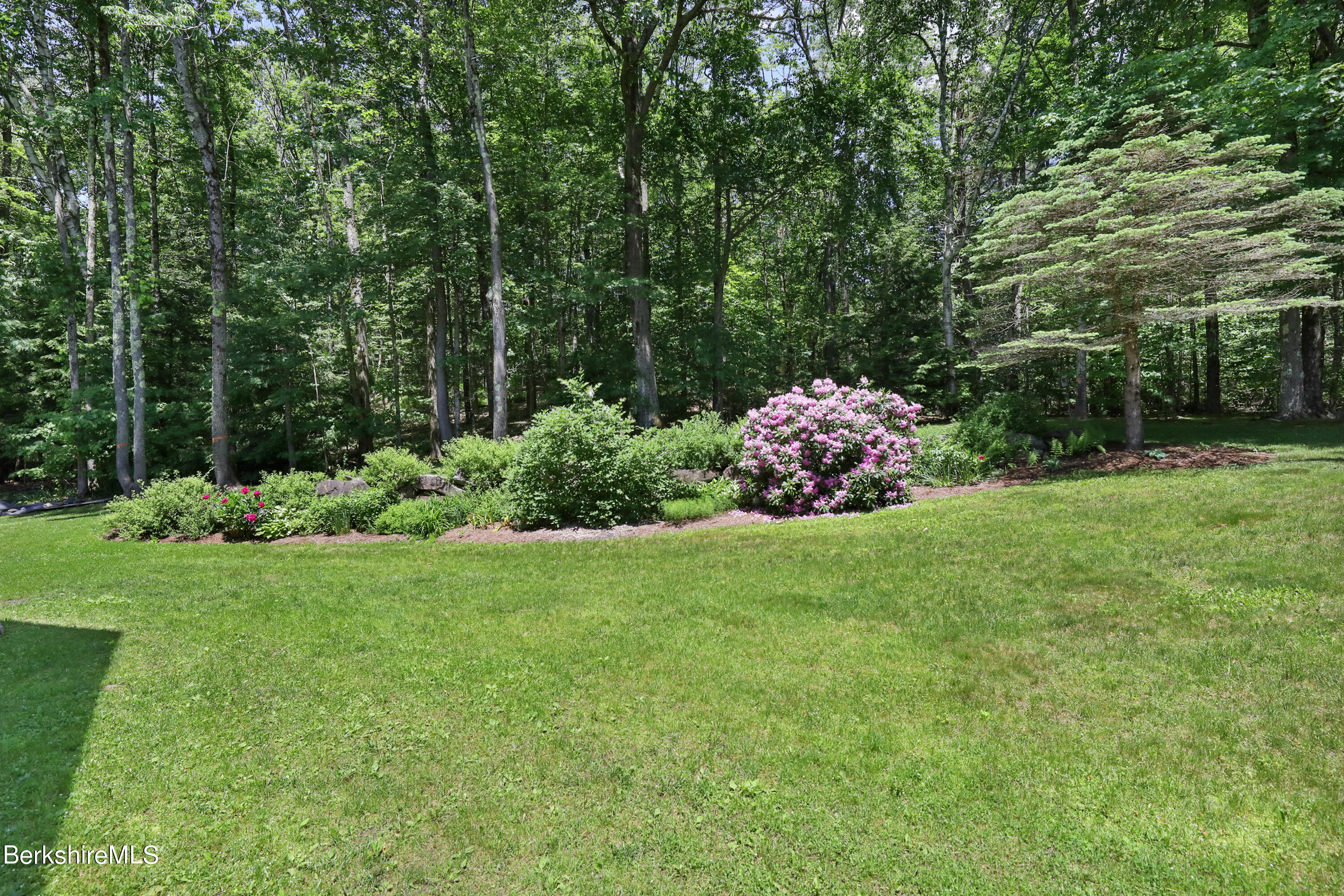86 George Carter Road Becket, MA 01223 - Photo 30 of 35 a garden view with a seating space