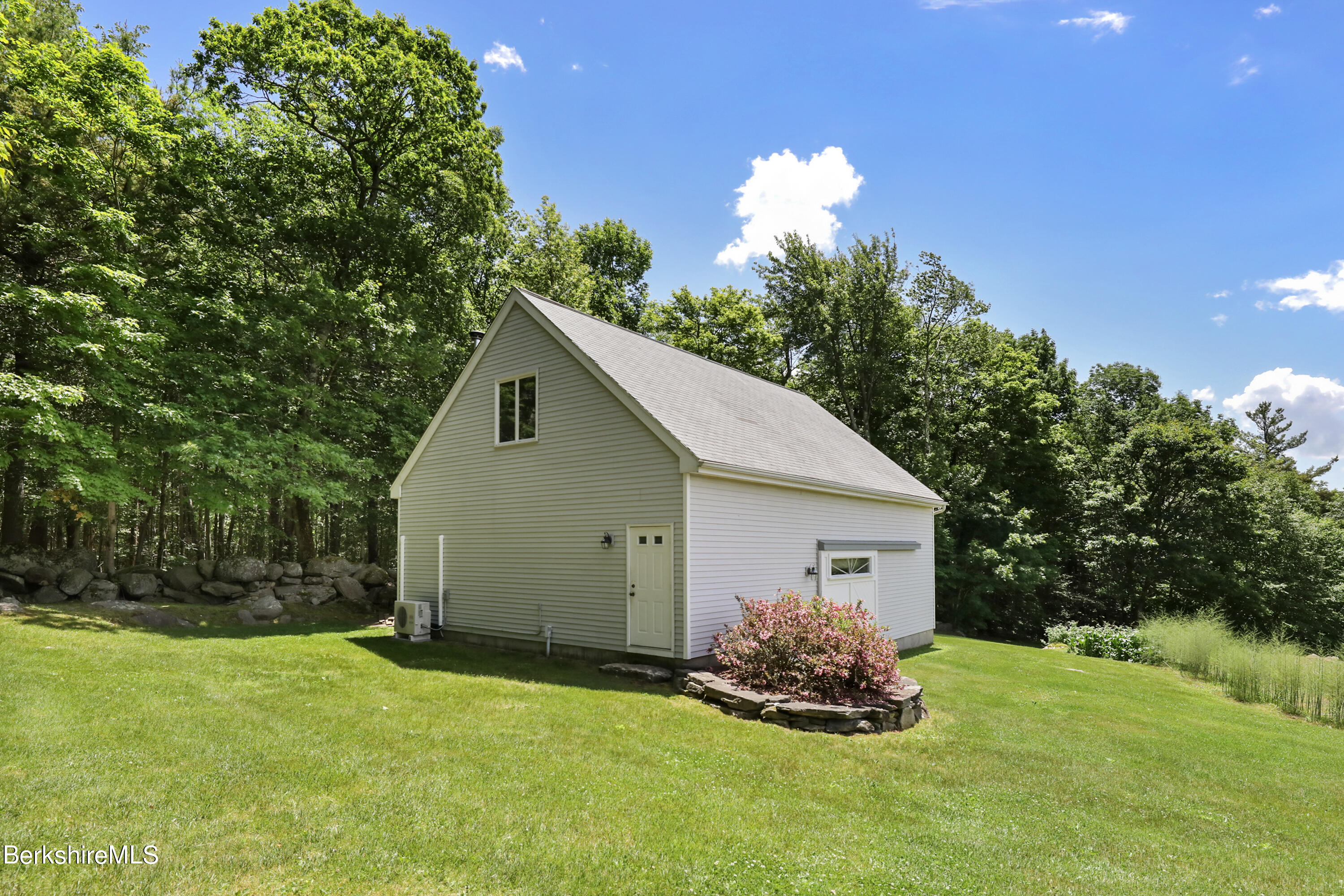 86 George Carter Road Becket, MA 01223 - Photo 32 of 35 a view of a house with backyard and garden