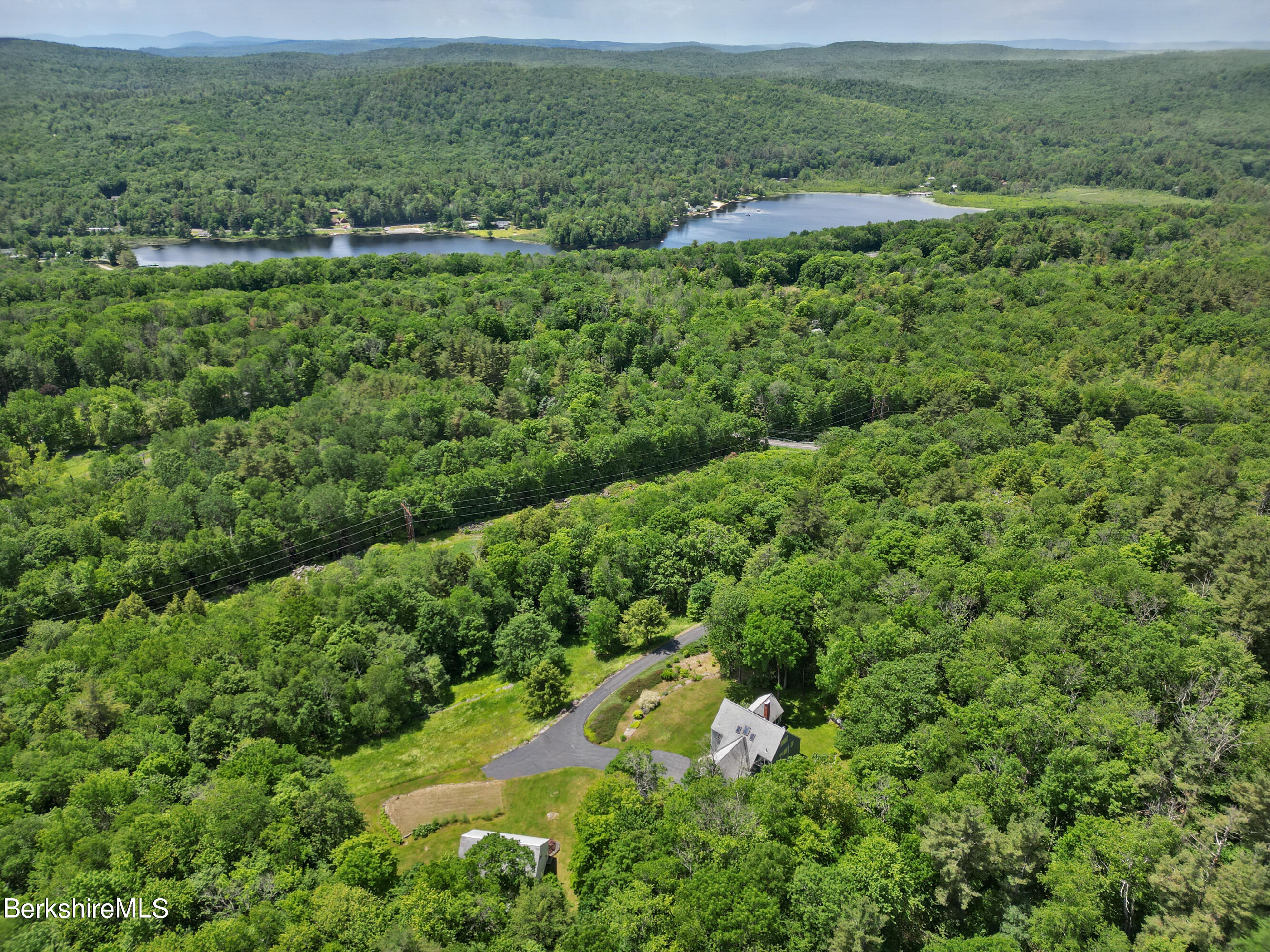 86 George Carter Road Becket, MA 01223 - Photo 33 of 35 a view of a lush green hillside and houses