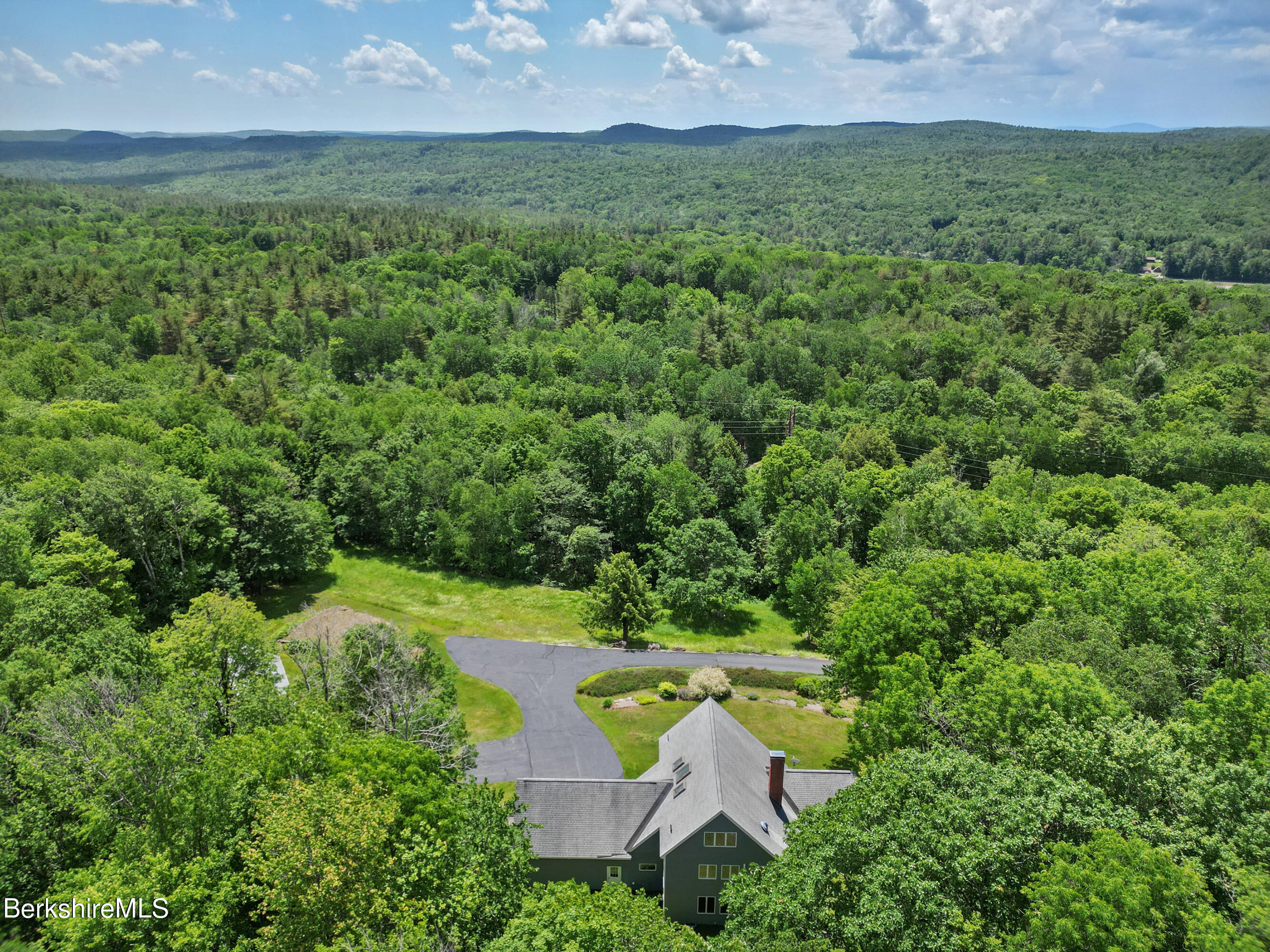 86 George Carter Road Becket, MA 01223 - Photo 34 of 35 an aerial view of a house with yard