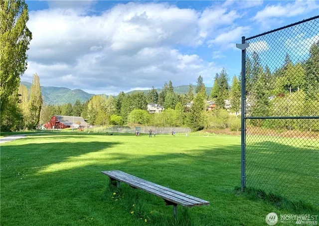 an aerial view of a house with yard swimming pool and outdoor seating
