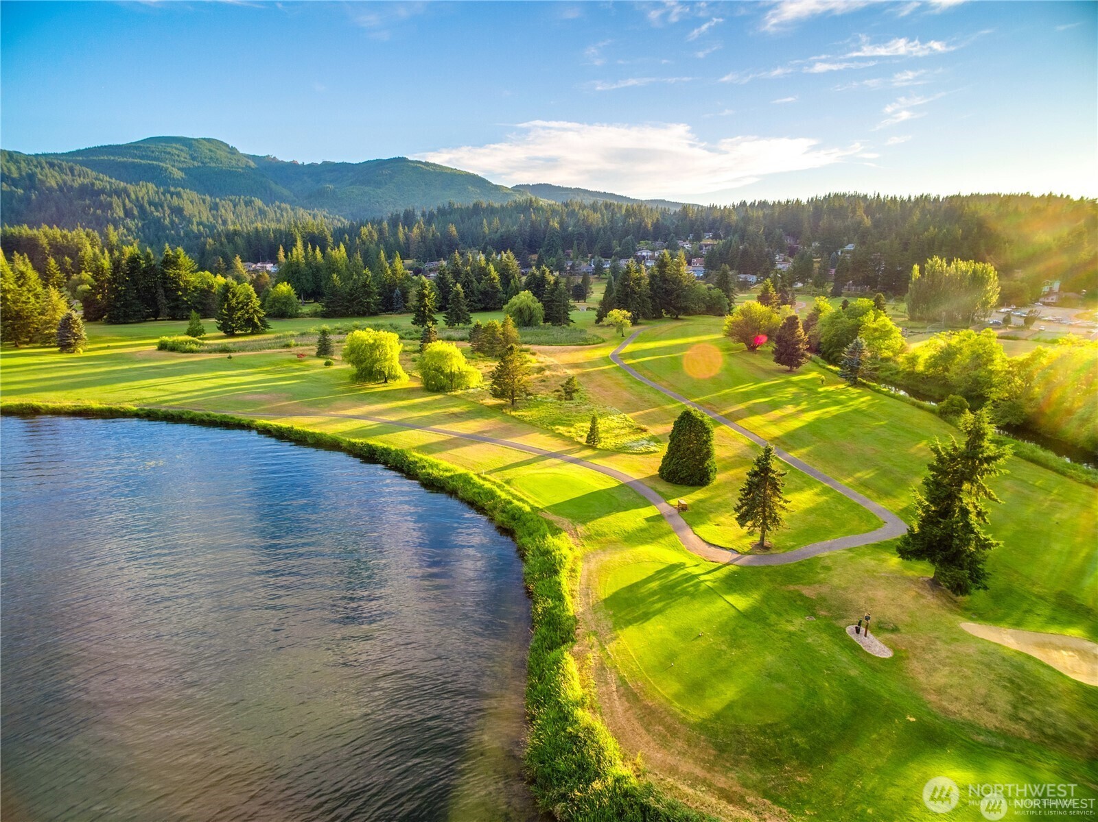 1 Southern Court Bellingham, WA 98229 - Photo 5 of 15 a view of a swimming pool with mountains in the background