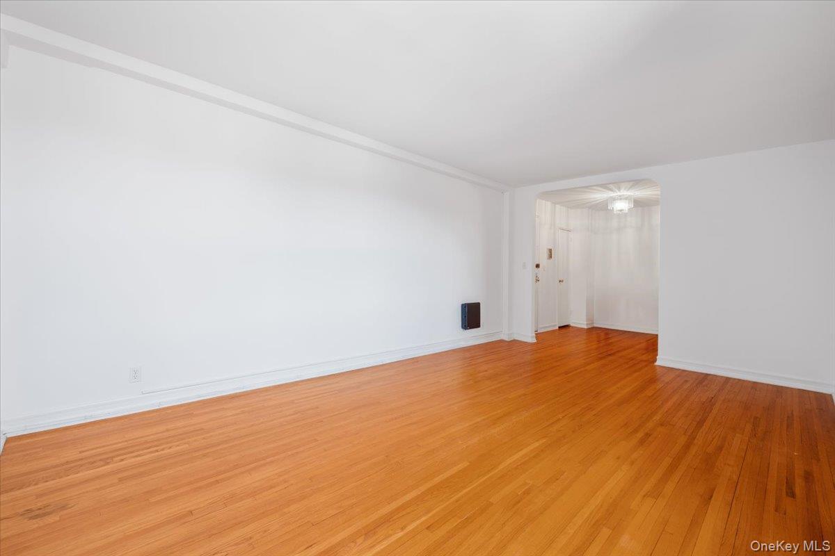 142 Garth Road, Unit 5K Scarsdale, NY 10583 - Photo 8 of 33 Living room and view of entrance foyer/dining area
