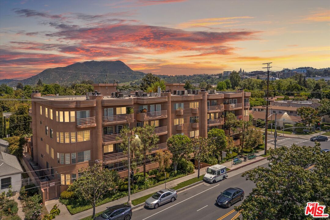4310 Cahuenga Boulevard, Unit 304 Toluca Lake, CA 91602 - Photo 1 of 35 a view of building with yard and mountain view in back