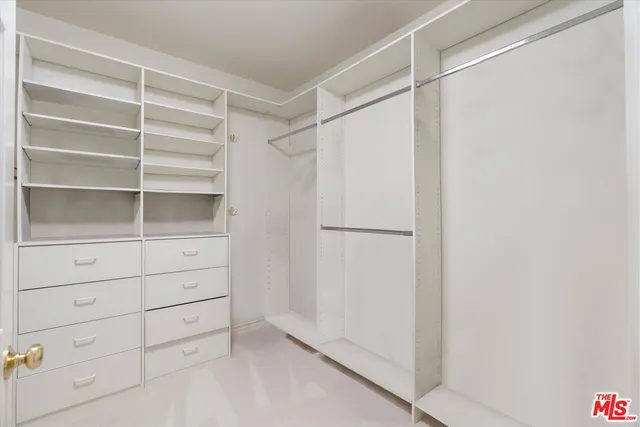 a view of an empty walk in closet